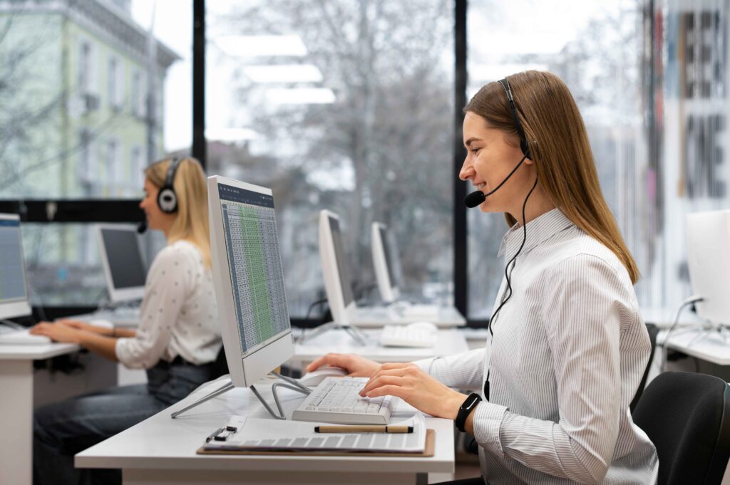 “Call center team collaborating in modern office environment, delivering customer service and support through AI-enhanced communication tools “